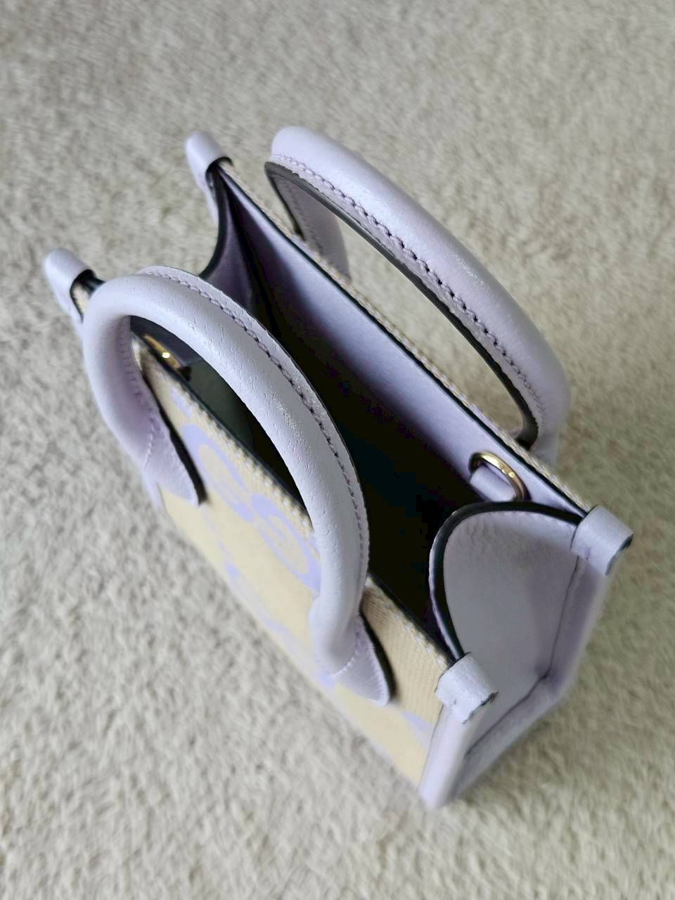 Gucci Jumbo GG Canvas Vertical Mini Tote