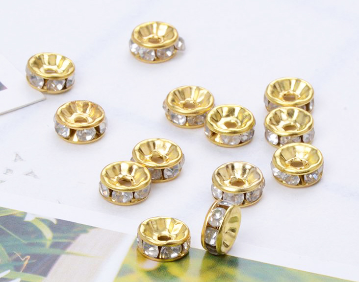 ขายส่ง ตัวแต่งคั่นเพชร สีขาว ขอบทอง 8มิล บรรจุ 100ชิ้น