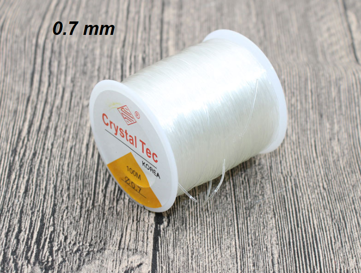 ขายส่ง เอ็นร้อยลูกปัด เอ็นยืด แบบเส้นกลม เบอร์ 0.7 (ขนาด 0.7มิล) สีใส (1ม้วน ความยาว 100เมตร)